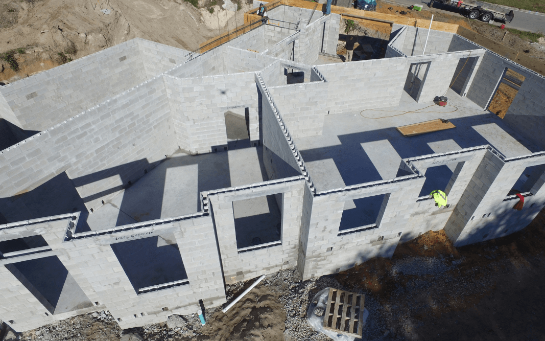 Concrete block shell under construction for a commercial building in Clermont, FL, by Bridgethorn Construction, showcasing structural phase of commercial construction.