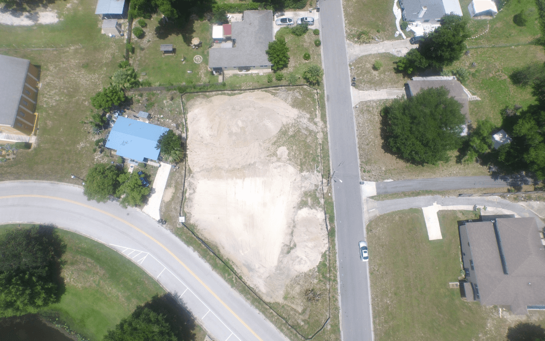 erial view of cleared land prepared for commercial construction in Clermont, FL, highlighting the early stages of project planning and site development by Bridgethorn Construction.