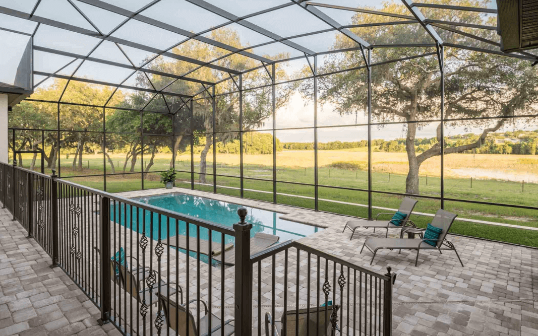 Outdoor living space with screened patio and pool in Clermont, FL, created by Bridgethorn, a trusted general contractor serving the area.