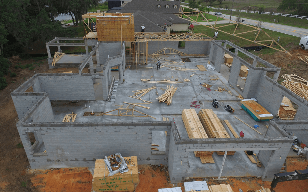 eneral contracting project in Clermont, FL, managed by Bridgethorn, showing the foundational and framing stages for a new build.