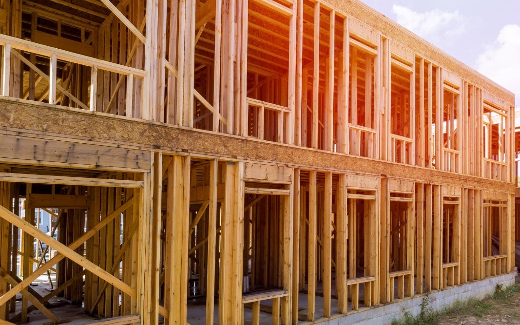 Wood framing of a multi-family residential building under construction in Clermont, FL, by Bridgethorn Construction, specializing in townhouse and apartment development.